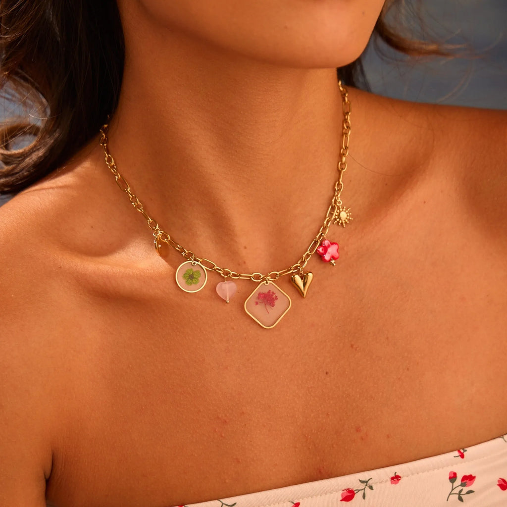 Stainless steel necklace with geometric epoxy flower pendant and 18K gold electroplated finish on a regular chain