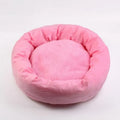 Soft light grey cotton-filled dog bed for a small dog, showing cloth material and round shape.
