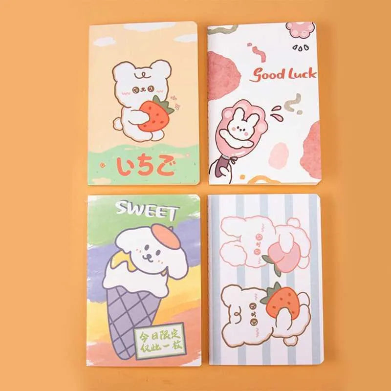 Cartoon A5 notebook with 30 sheets showing character designs including Strawberry Rabbit and Cute Bear