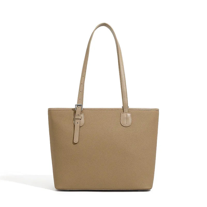 Women's genuine leather tote bag 30cm wide in black colour showing internal zipper compartments and retro styling