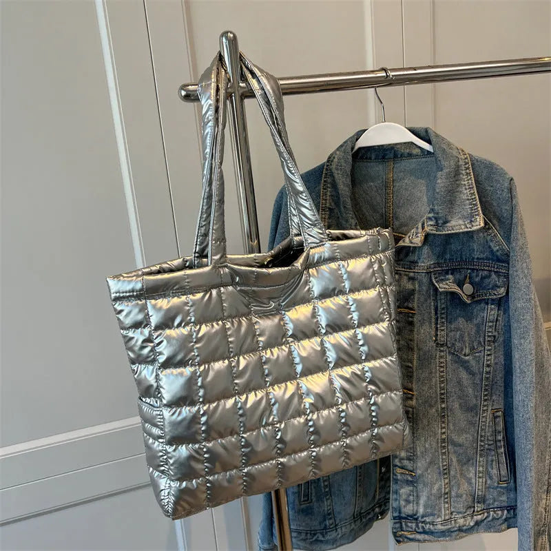 Large nylon plaid bucket shoulder bag in black with rhombus pattern, magnetic buckle, and soft handle.
