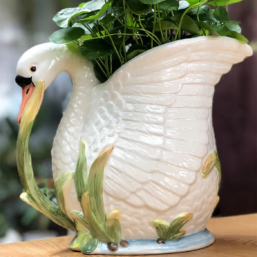 Ceramic vase with embossed swan pattern, pastoral style, 24.1cm length, picture colour, on a shelf