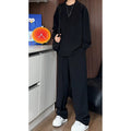Men's black casual two-piece suit with long sleeve polo shirt and trousers in slim fit design