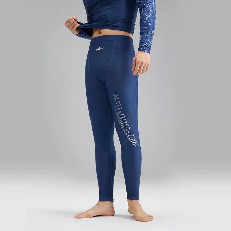 Dark blue men's two-piece swimwear set with a top and trousers on a mannequin.