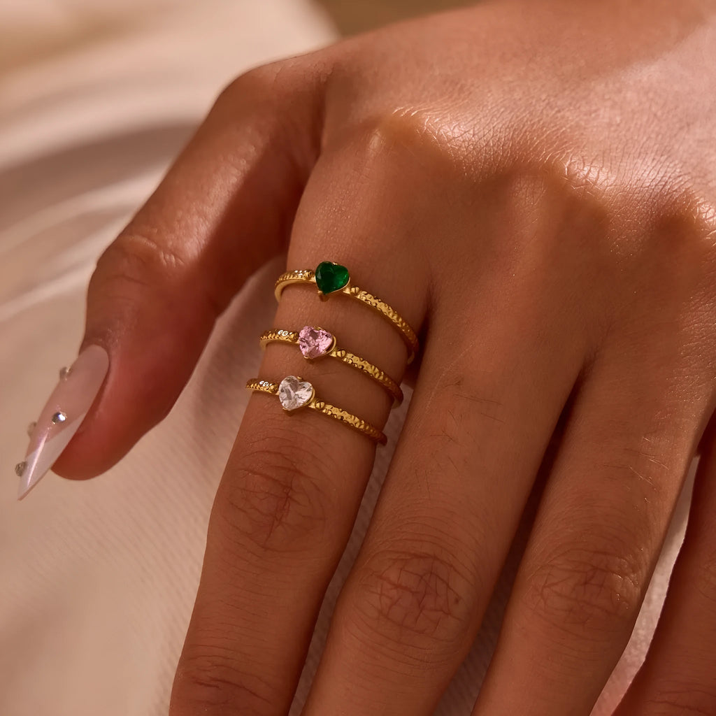 Heart-shaped open-ended ring with geometric design and inlaid zircon detail in stainless steel