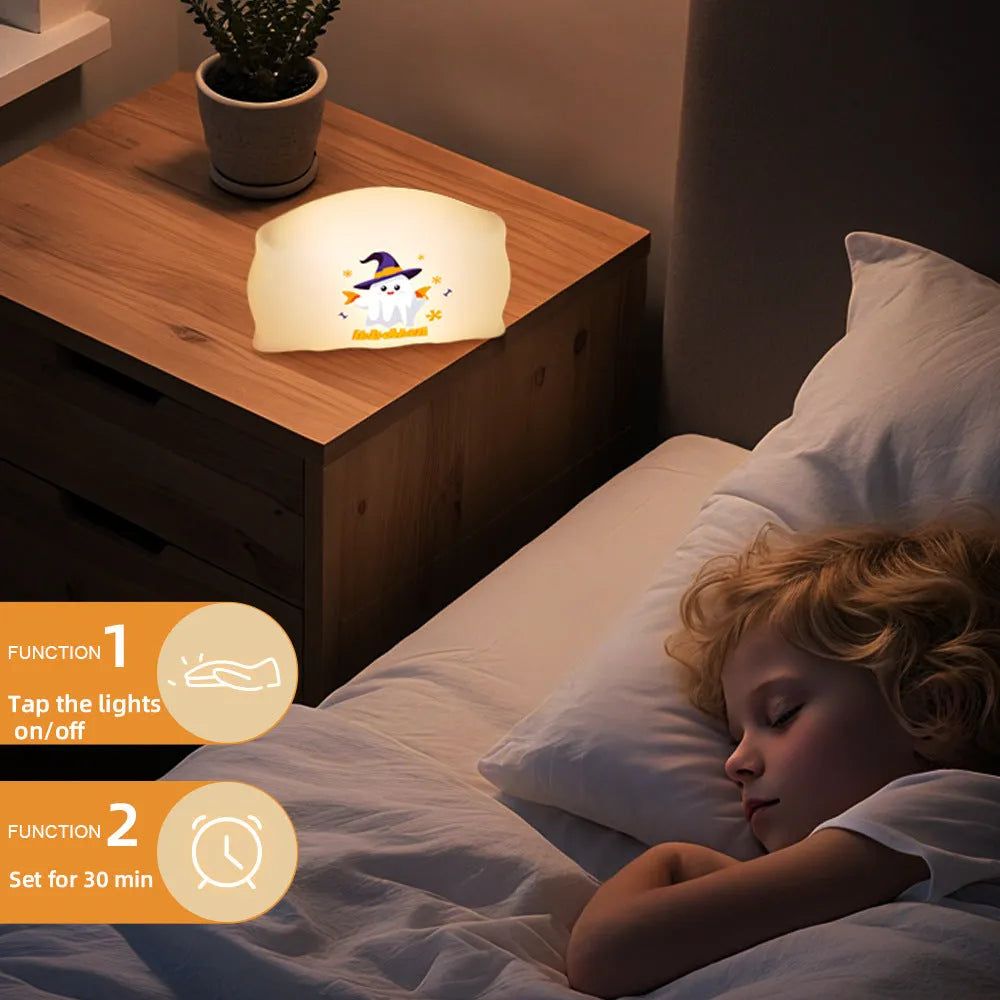 Small cartoon ghost doll table lamp with warm light, showing Magic Ghost and Pumpkin Ghost colour options.