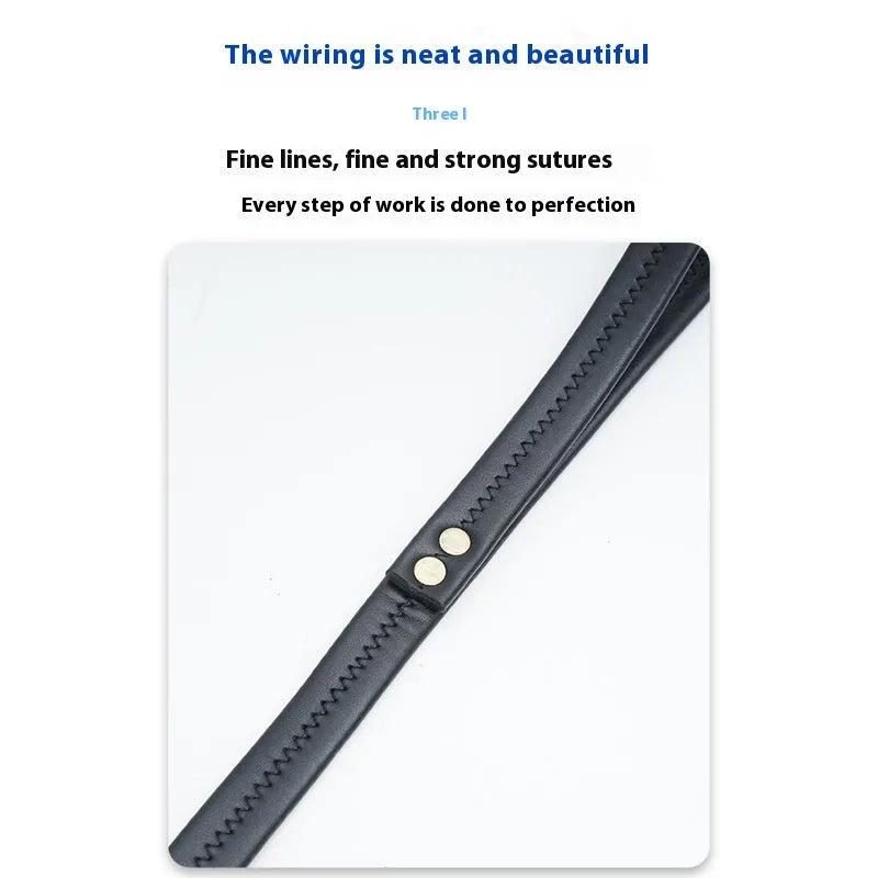 Black PU leather dog traction belt with metal clip, laid out to show length.