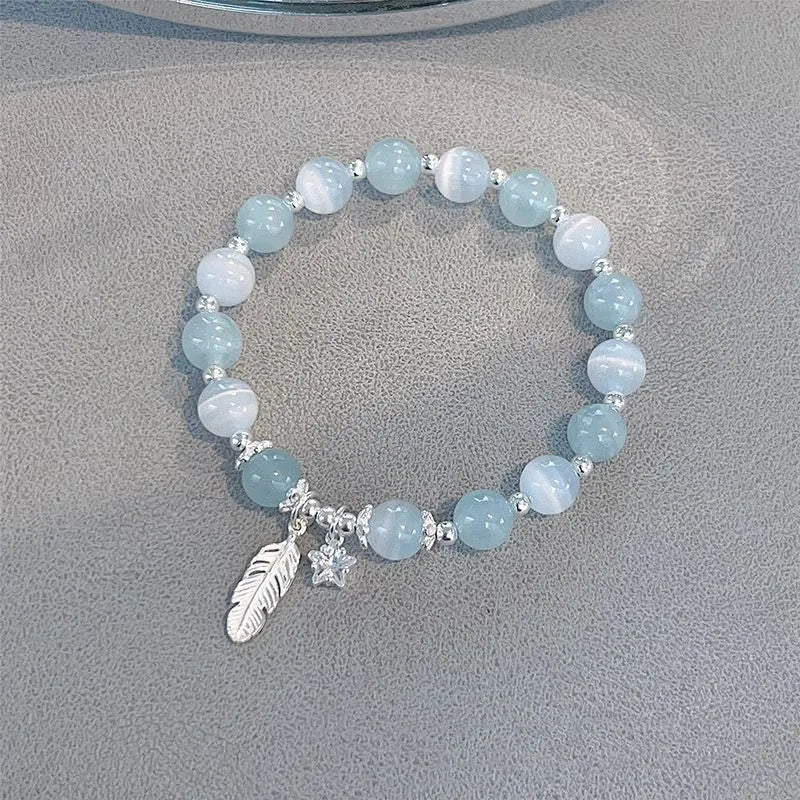 Crystal bracelet with Korean style design featuring letters text in blue moonlight colour
