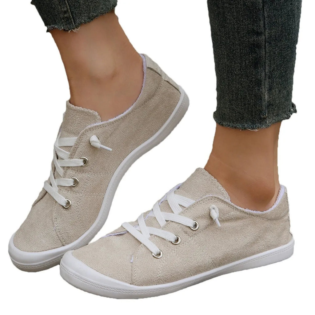 Women's creamy white casual sneakers with soft fabric upper and rubber sole