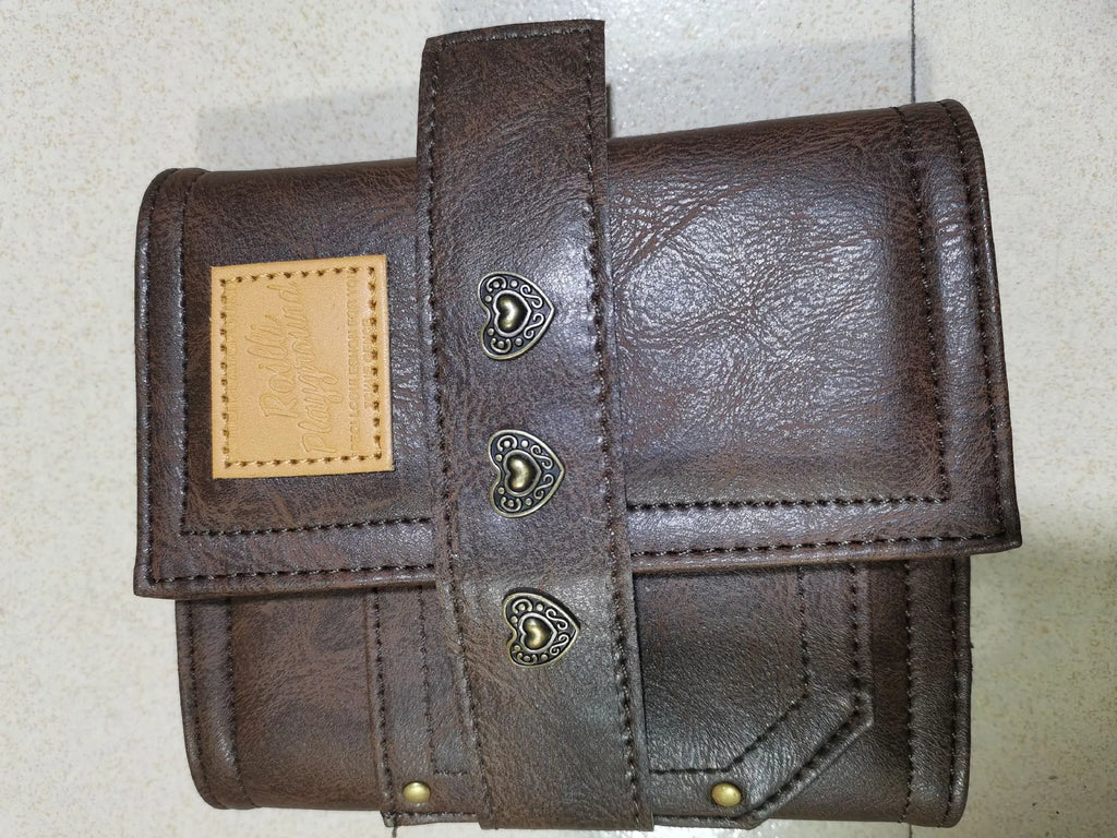Brown retro-style A7 notebook with a PU cover and leather buckle, shown open to reveal loose-leaf binding.