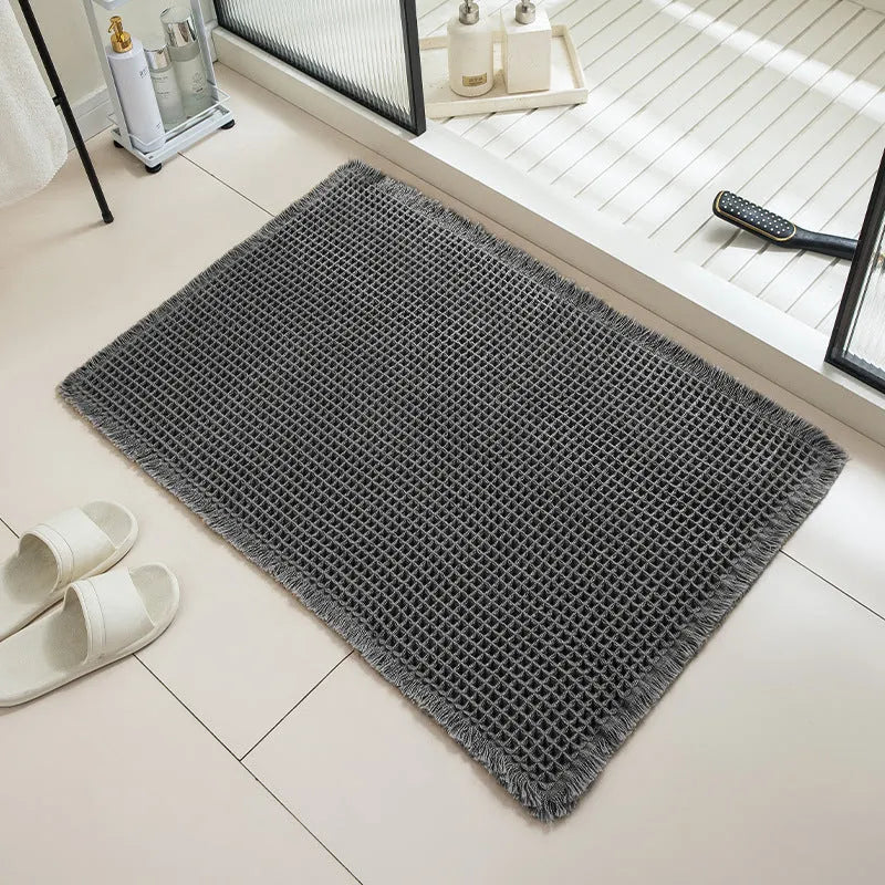 Checkered non-slip bathroom floor carpet in beige, available in multiple sizes from 43x61cm to 61x183cm