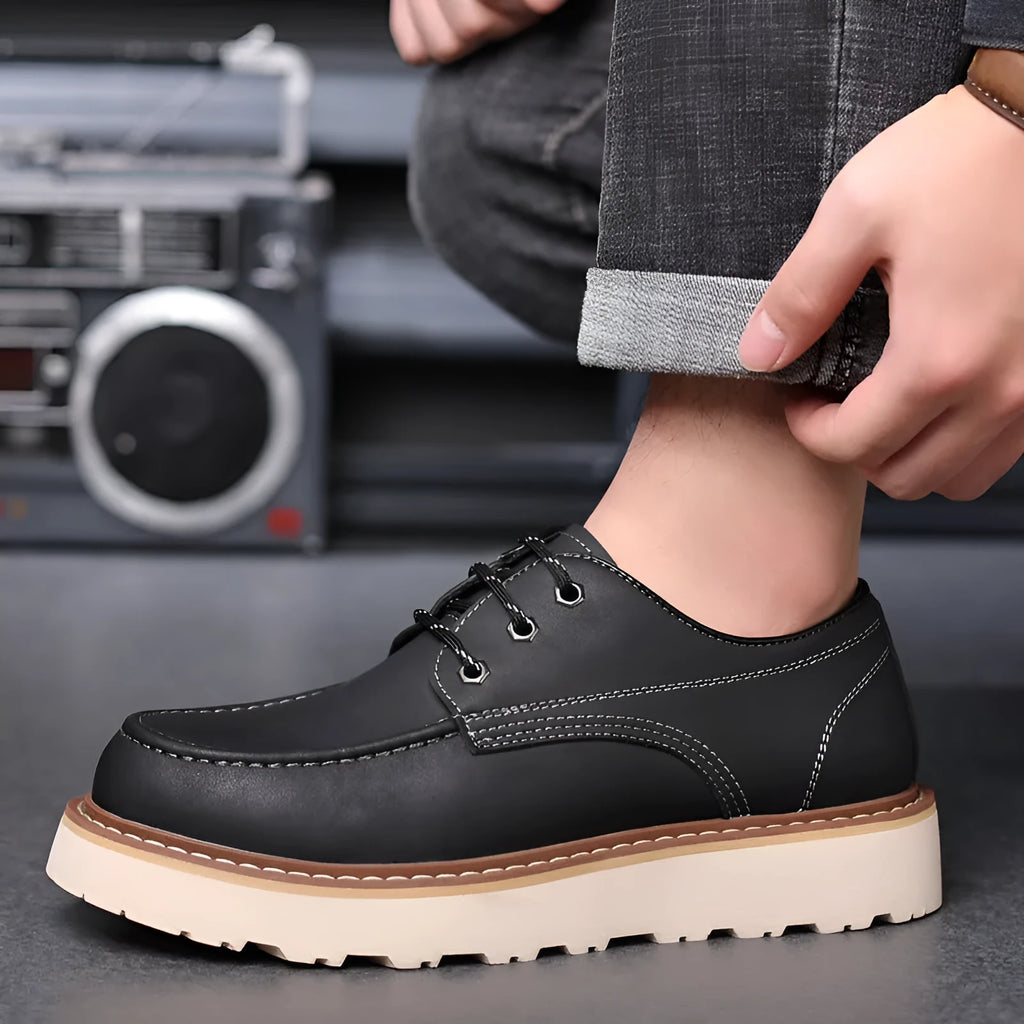 Men's black retro low-top Martin boots with a round toe and rubber sole on a white background