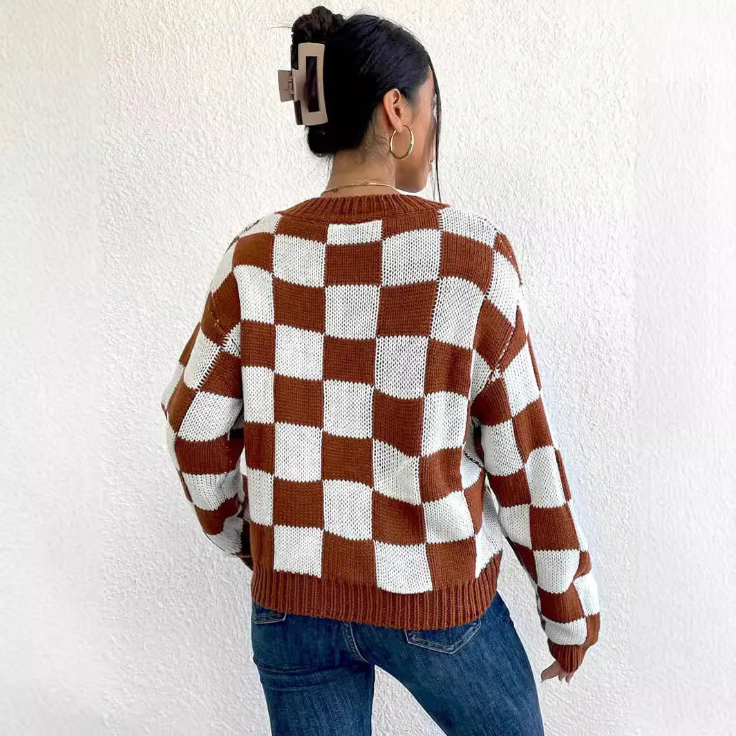 Dark brown loose fit acrylic pullover sweater with a chessboard plaid pattern and long sleeves.