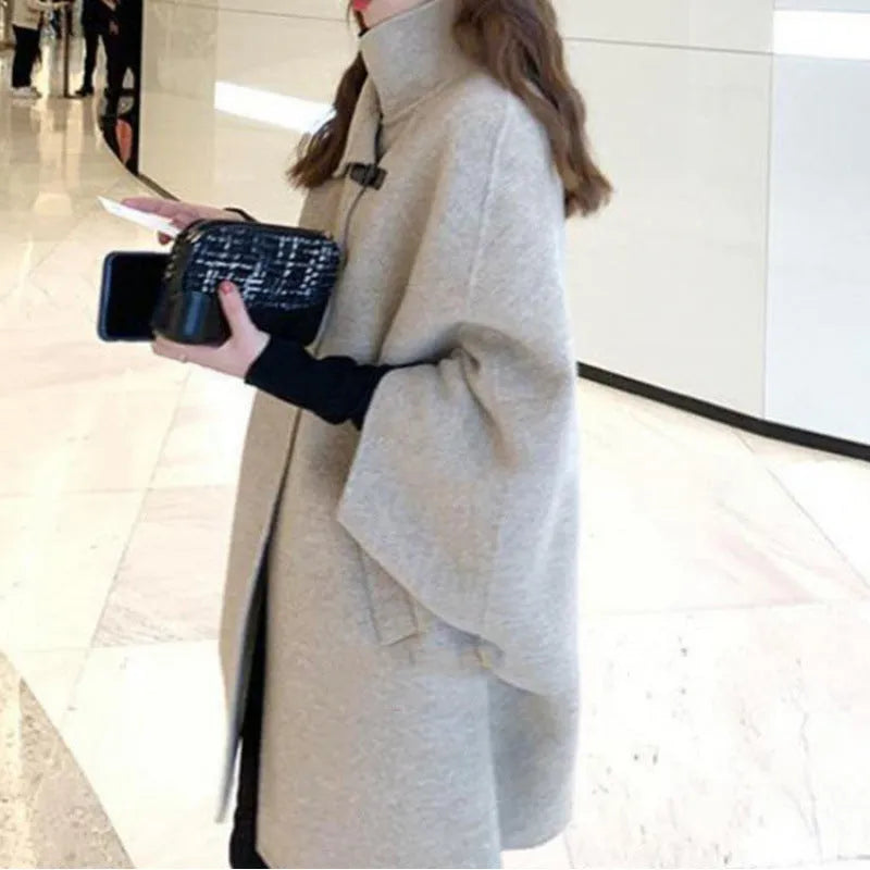 Women's long acrylic coat in oatmeal colour with flight sleeves and 100cm length