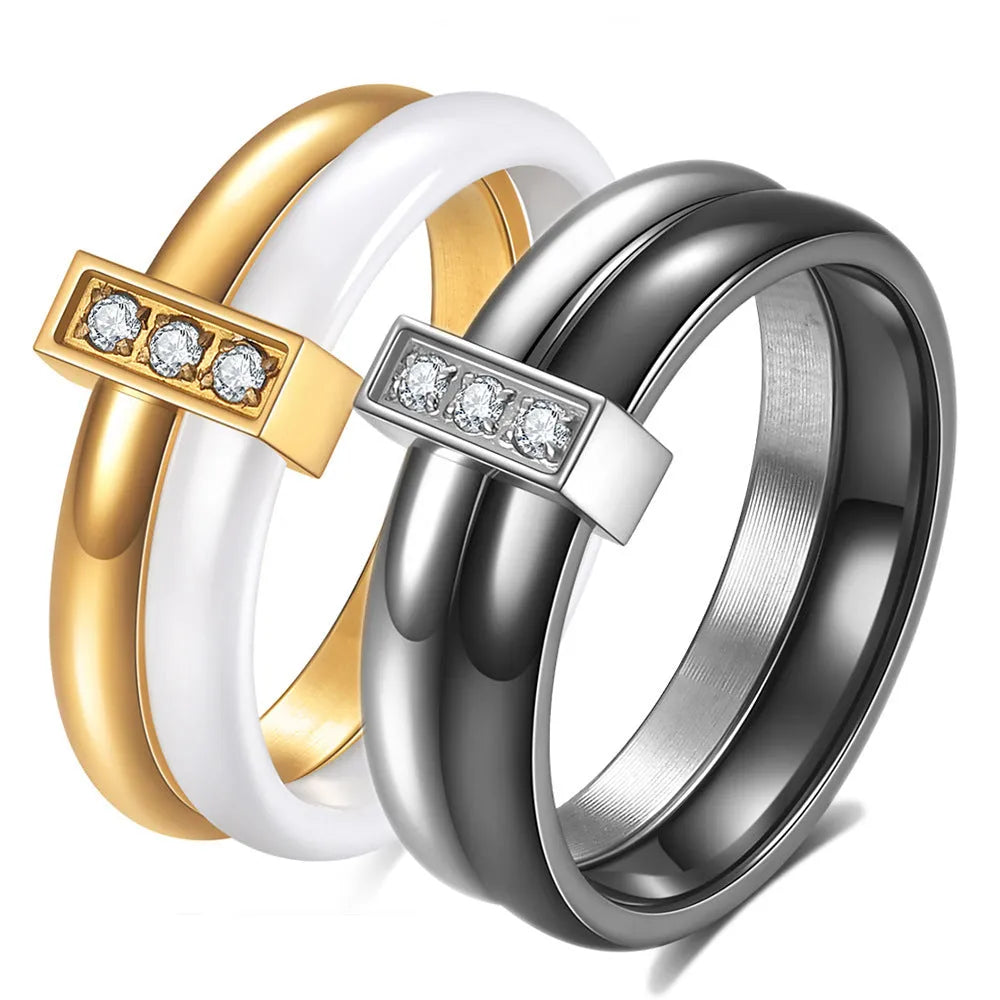 Geometric ceramic women's ring with glossy stitching and inlaid zirconium detail, shown in steel black.