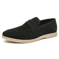 Men's beige leather slip-on casual shoes with a round toe and mid heel on a rubber sole.