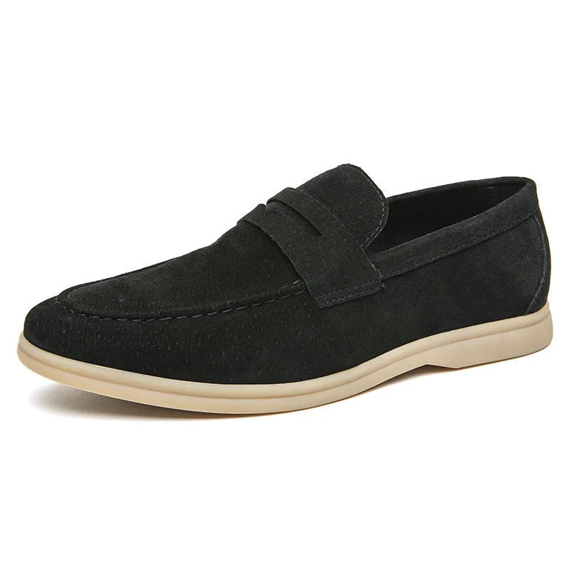 Men's beige leather slip-on casual shoes with a round toe and mid heel on a rubber sole.
