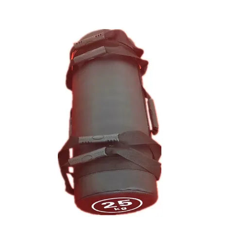 Flat white leather PVC fitness training sandbag for weight lifting on a gym floor.