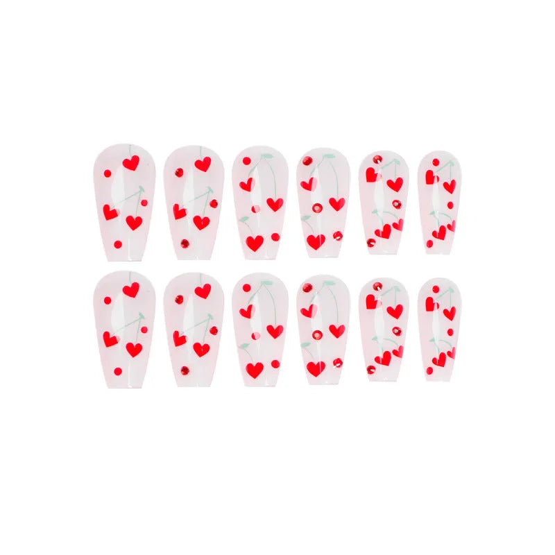 Pack of 24 red French love themed nail art stickers with small cherry and diamond designs, includes glue.