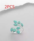 Silver green agate bubble eight leaf ring for men and women on a neutral background showing green stone centrepiece
