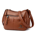 Soft square black PU leather women's crossbody shoulder bag showing front view and open interior with multiple pockets.
