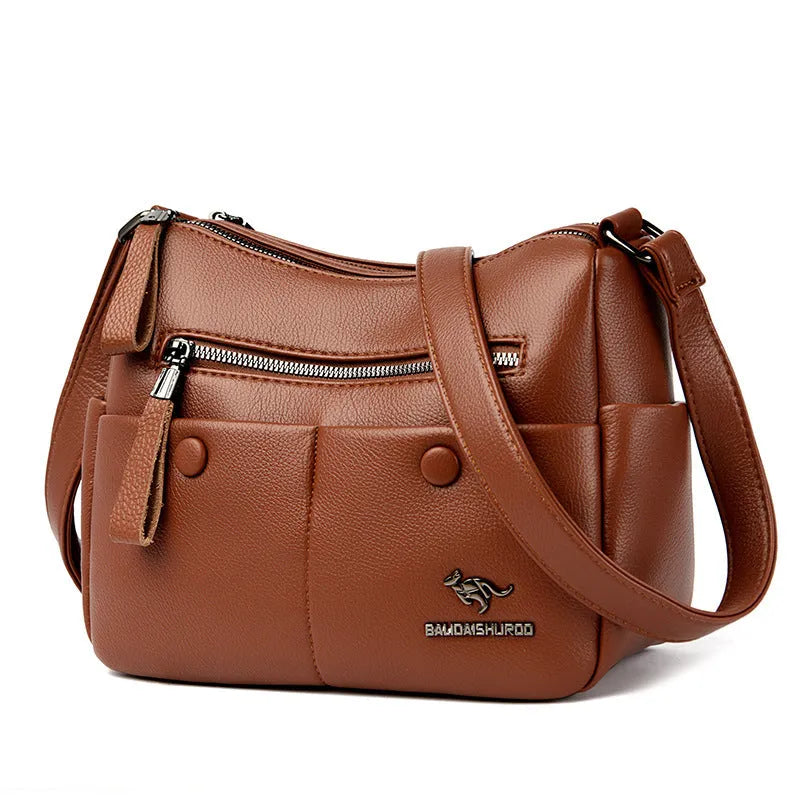 Soft square black PU leather women's crossbody shoulder bag showing front view and open interior with multiple pockets.