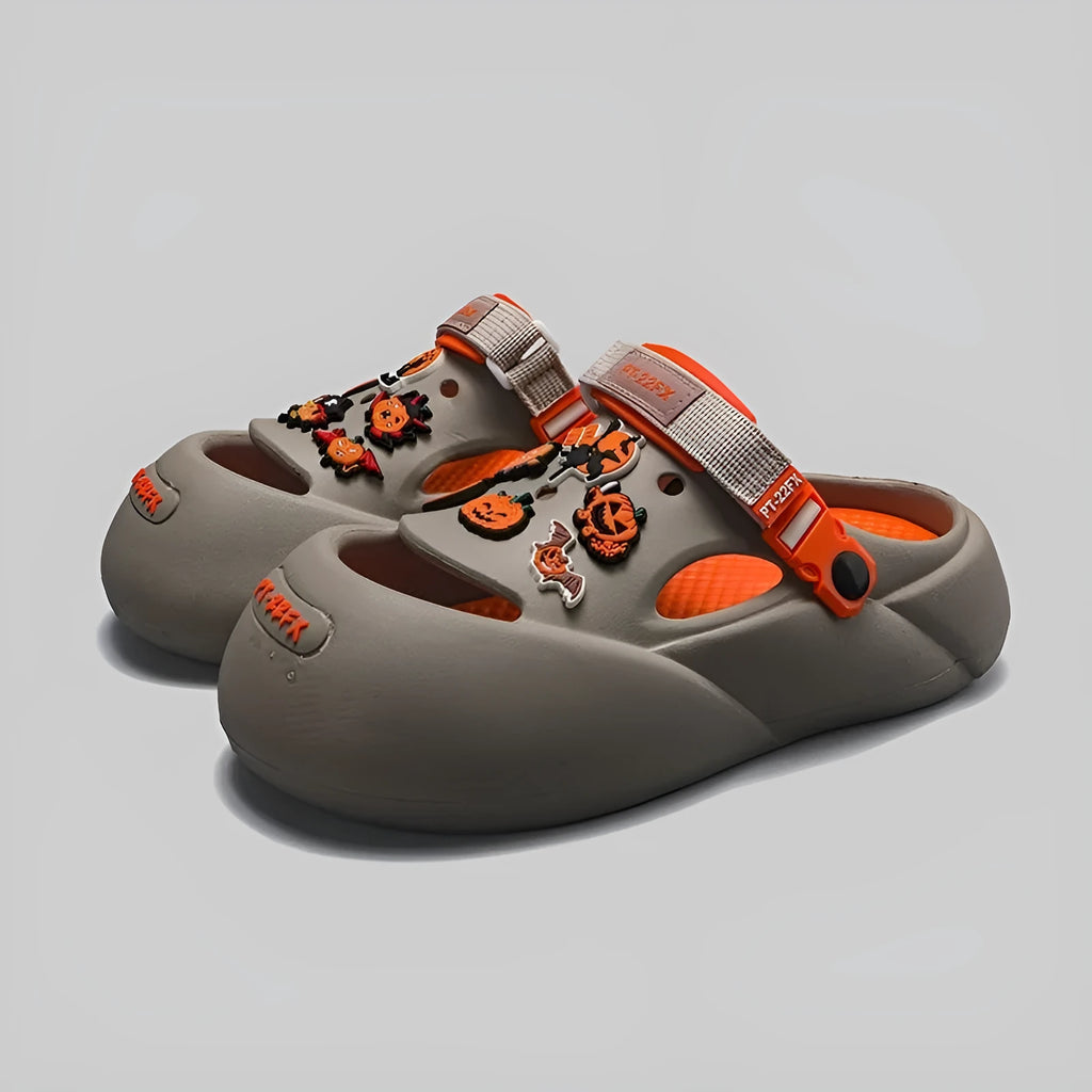Men's grey baotou beach shoes with hole design and lightweight EVA sole on a sandy background.
