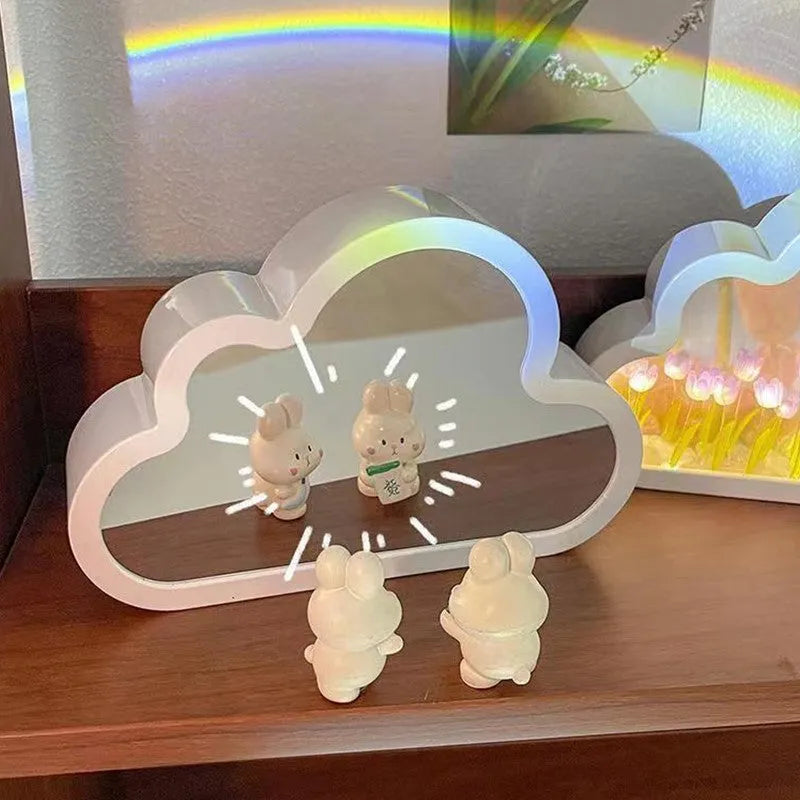 Assembled pink tulip-shaped night lamp with LED light, mirror front, and small photo frame on a desk.