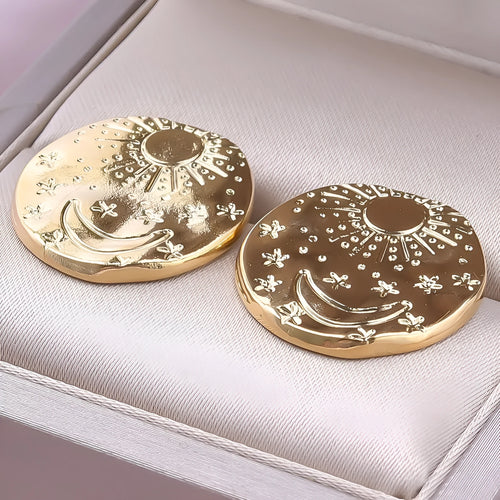 A pair of geometric shell design stud earrings in 304 stainless steel with gold or silver electroplated finish.