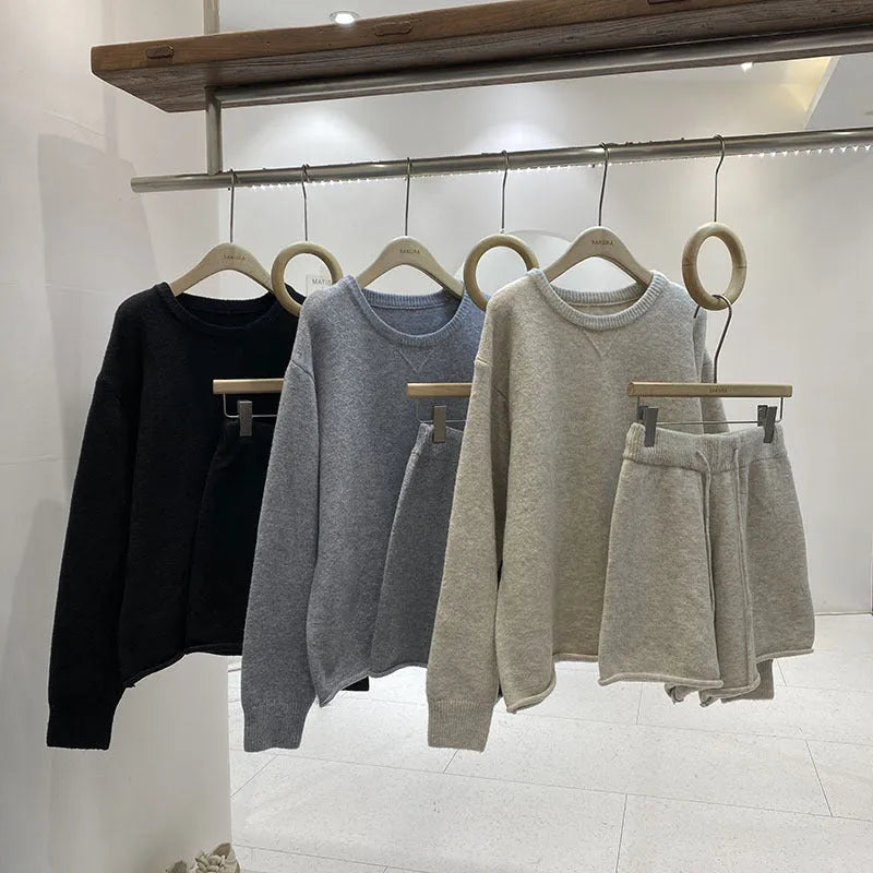 Women's loose-fitting long sleeve sweater and knitted wide leg shorts two-piece set in oatmeal colour.