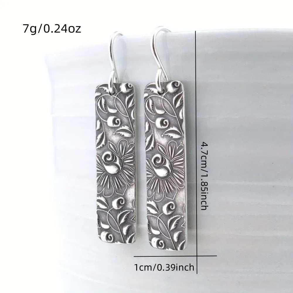 Silver geometric long earrings with carved vine patterns on zinc alloy
