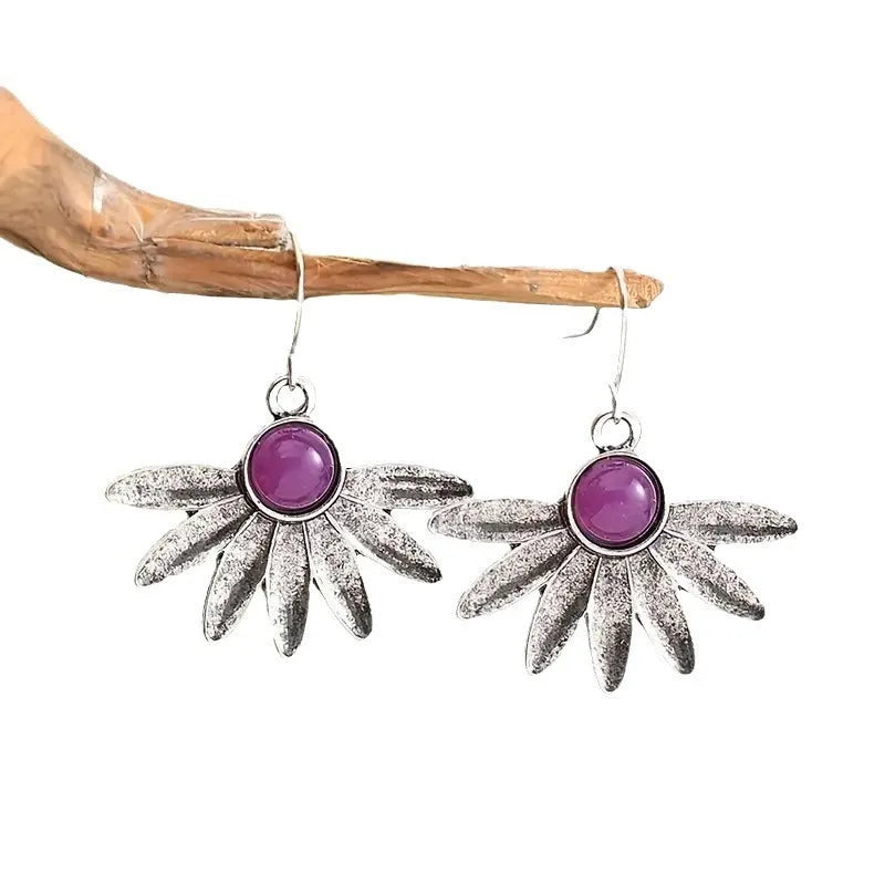 Purple bohemian earrings with resin gemstone details and animal or zodiac modelling