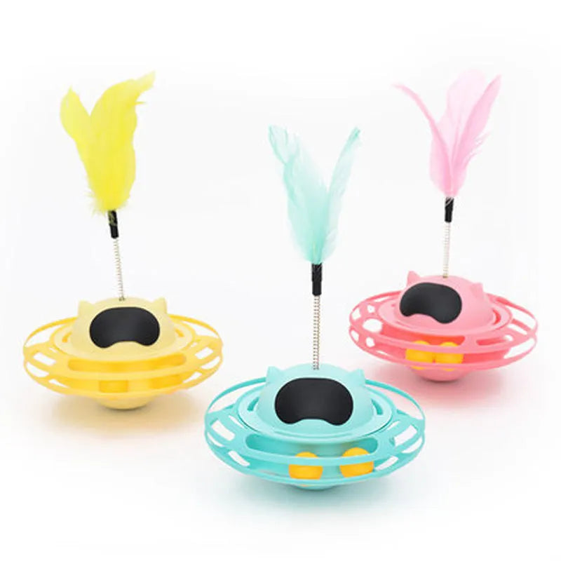 Pink cat tumbler turntable toy with self-moving rotational action for interactive feline play
