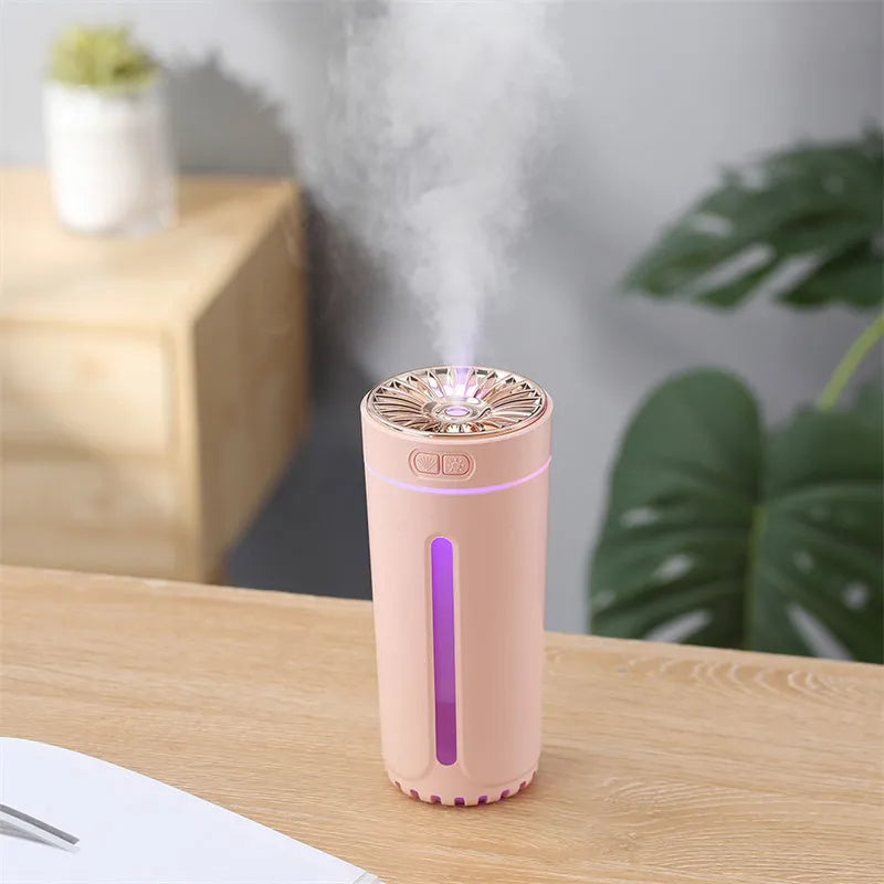 Black portable car humidifier with colourful lights on a car dashboard cup holder