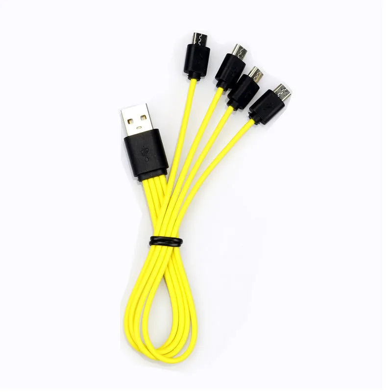 Four green USB rechargeable lithium AA batteries with a black charging cable on a white background