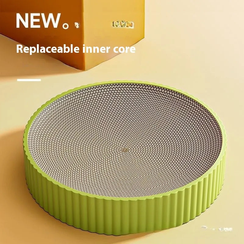 Round green and white corrugated paper cat scratching board and bed, 55cm diameter.