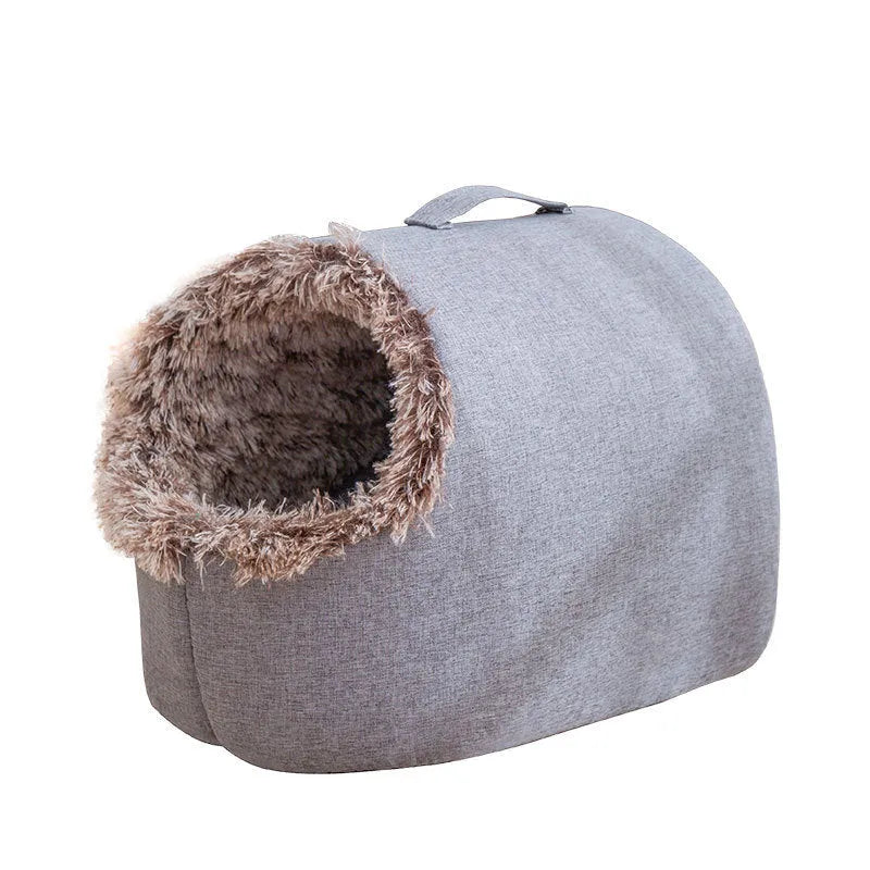 Grey fleece-lined enclosed cat sleeping bag bed for pets in a cage.
