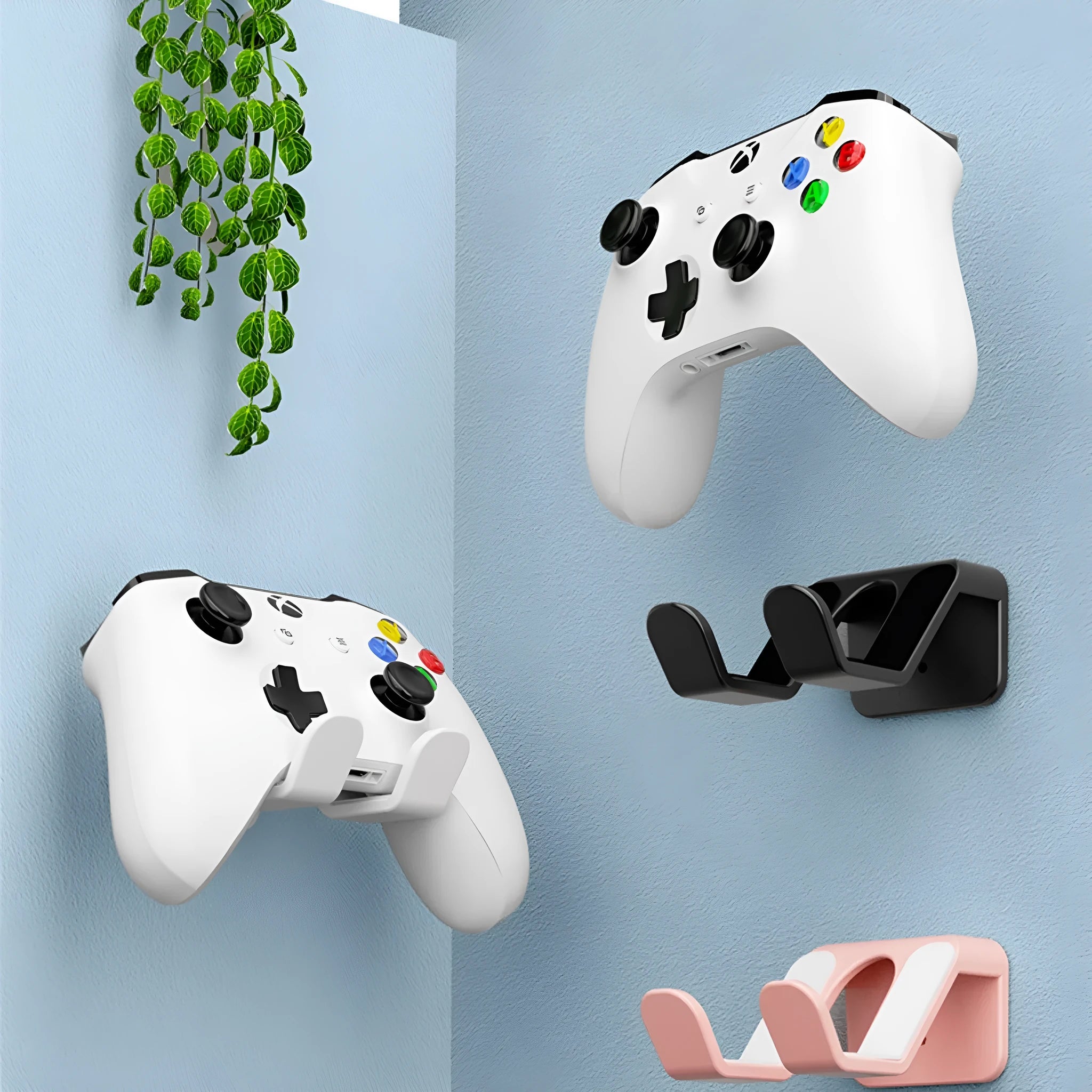 Black ABS plastic wall-mounted rack holding game controllers with nail-free glue and screws for installation.