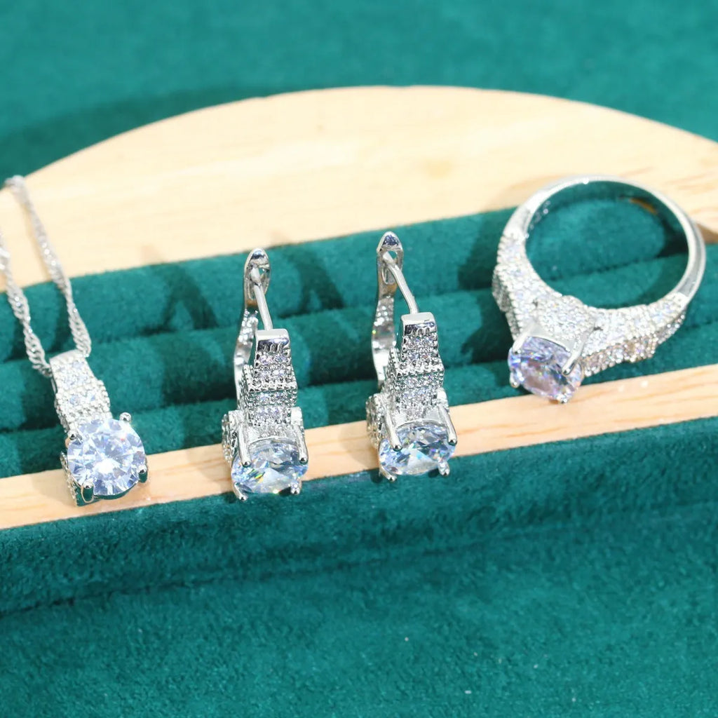 Bridal zircon jewellery four-piece set showing necklace, bracelet, earrings and ring with water wave chain