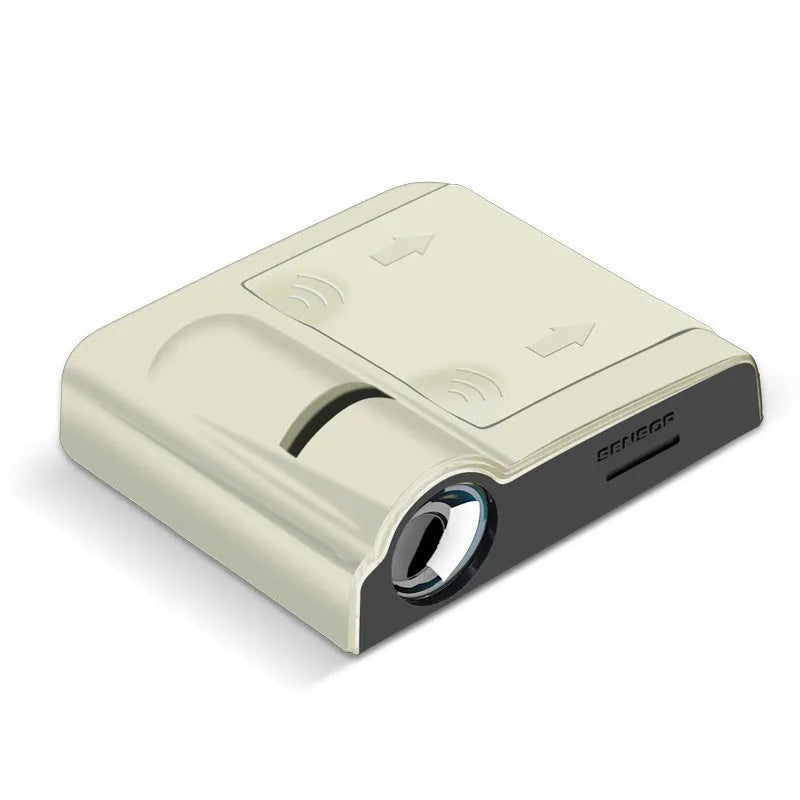 Compact black and beige ABS plastic car decorative projection radium lamp shown with AA batteries.