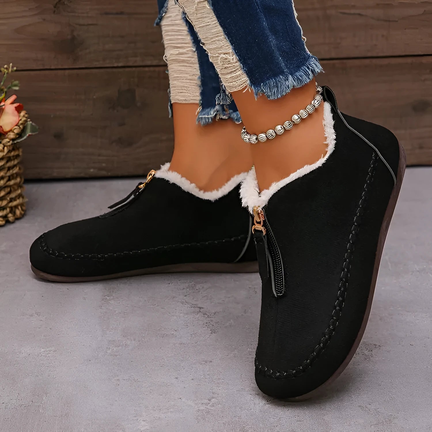 Women's suede retro low top boots in black showing low-top profile and rubber sole