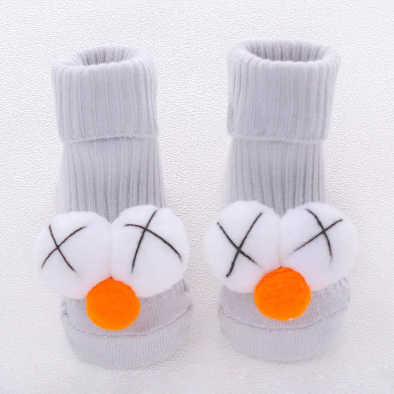 Cotton baby socks with non-slip soles in multiple designs including bows, stars, and animal prints.