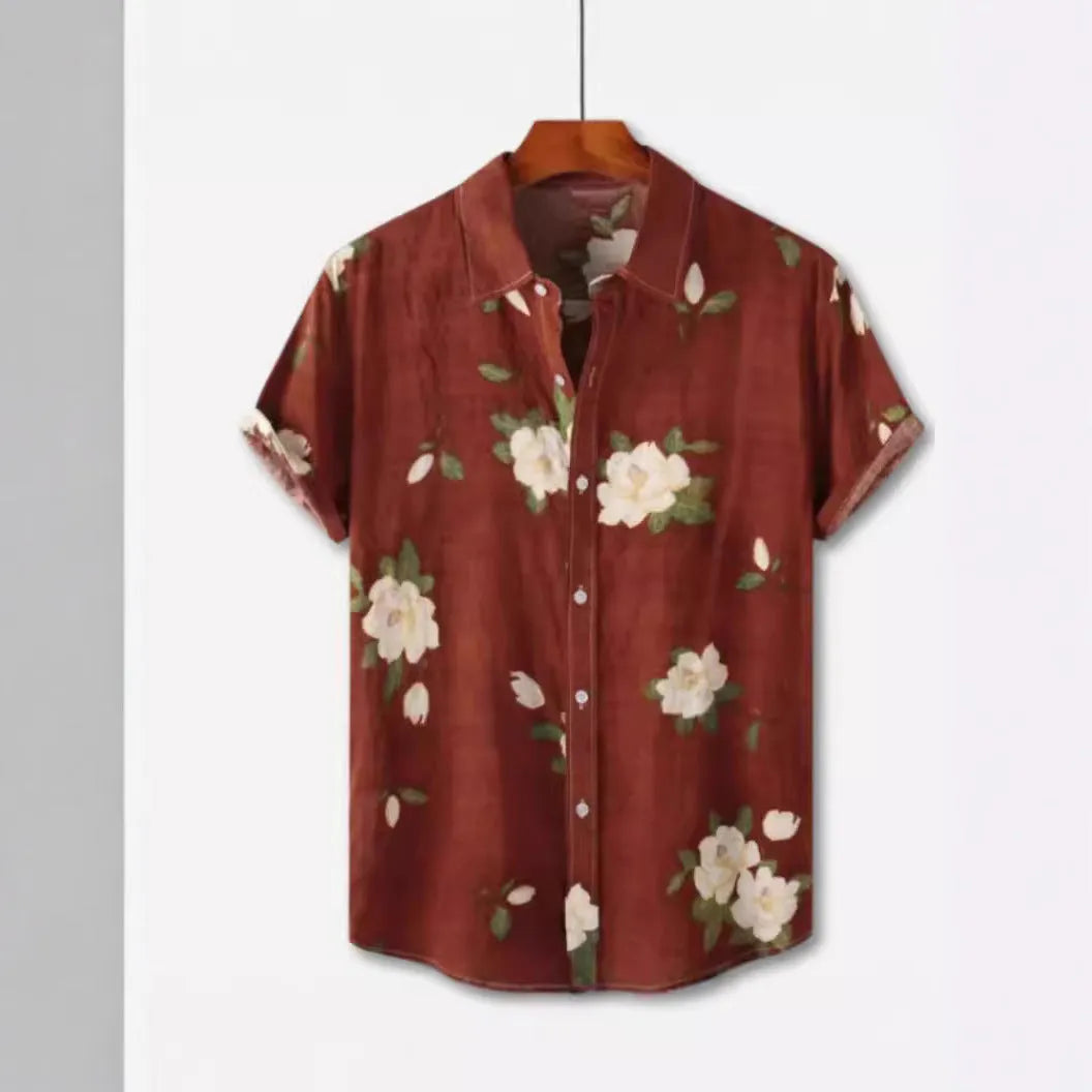 Man wearing a short sleeve Hawaiian print shirt with lapel collar in a floral pattern.