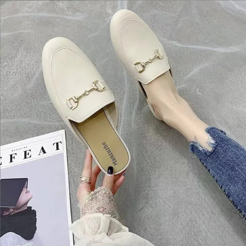 Women's PVC closed-toe half slipper with a buckle, shown in milky white colour.