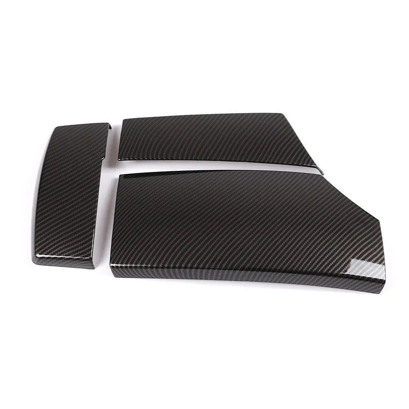 Set of three black ABS car armrest box protective covers with a diagonal carbon fibre weave pattern and shiny surface.