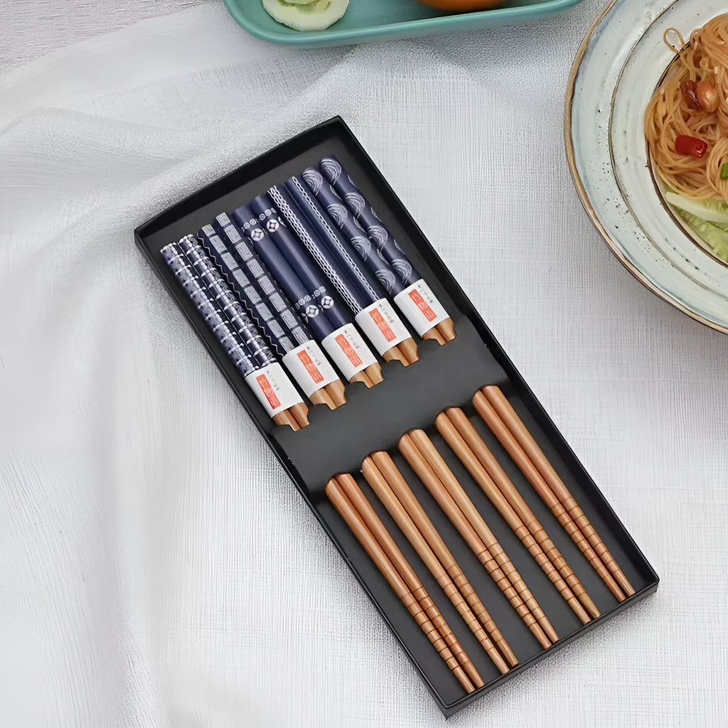 Set of five pairs of bamboo chopsticks with colourful Japanese lucky cat and elegant blue patterns.