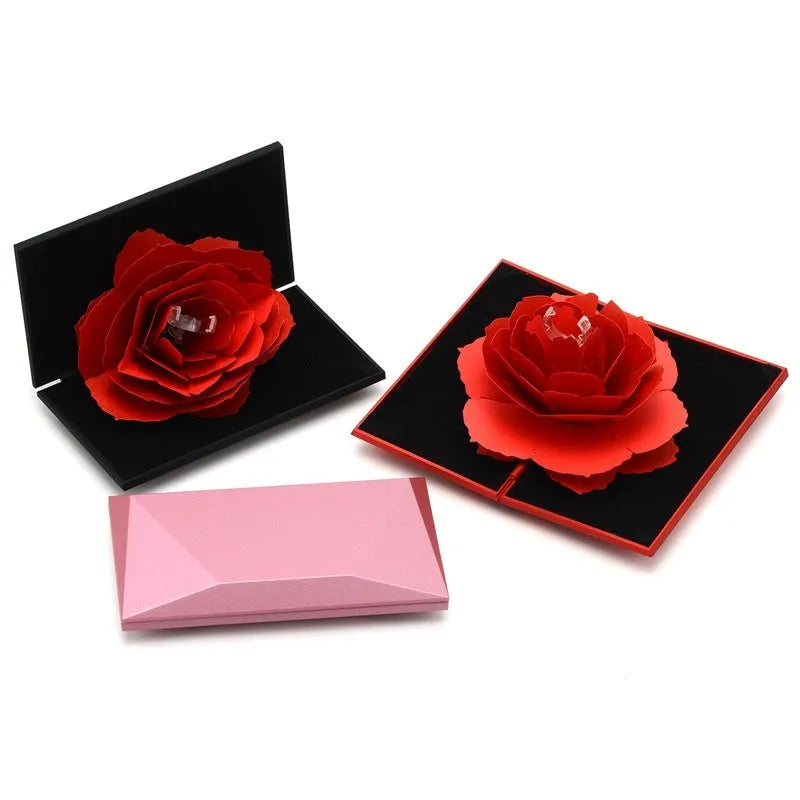 Red rotating ring box with 3D heart-shaped rose decoration for jewellery display