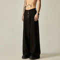 Men's solid colour wide-leg casual trousers in black, showing elastic waist and straight leg cut.