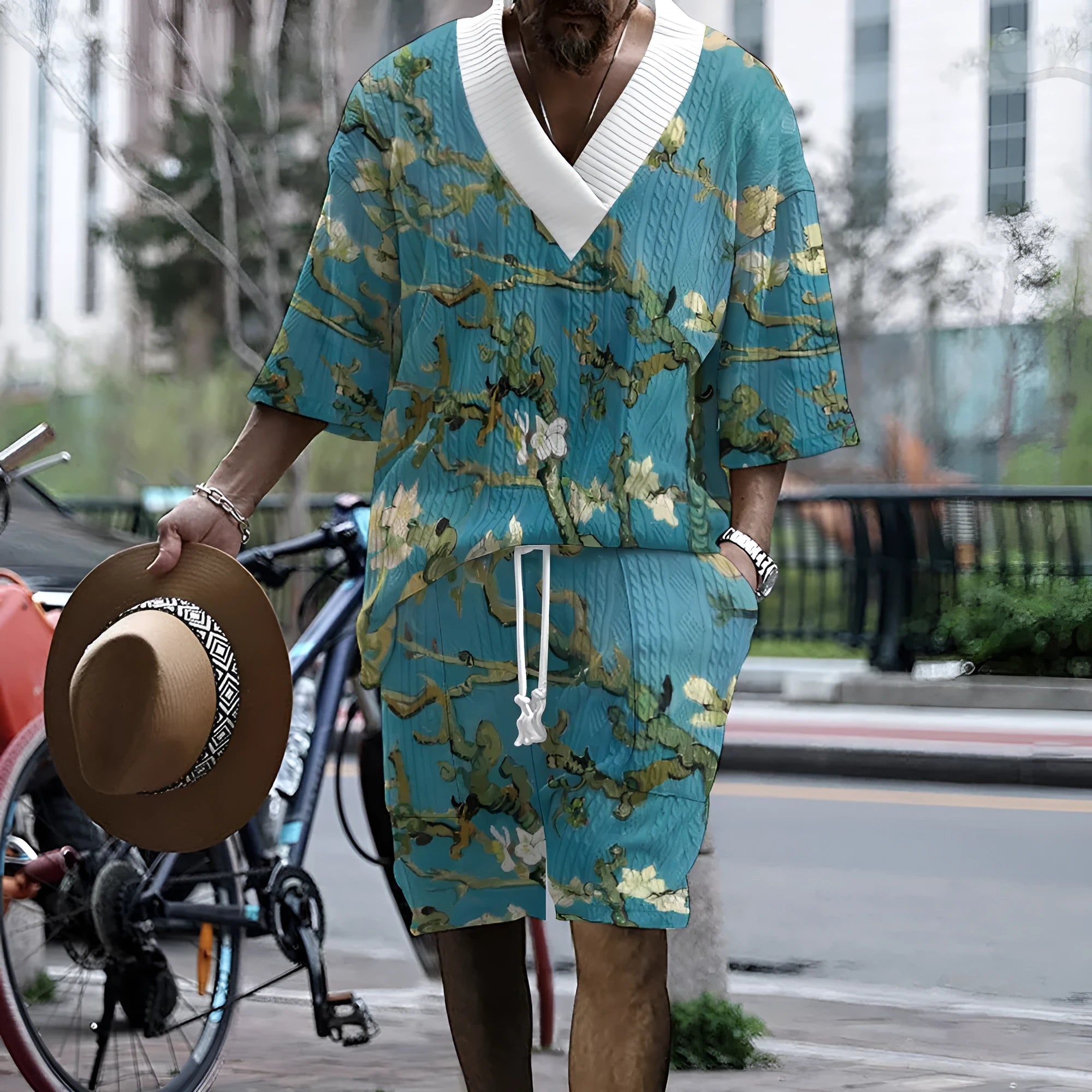 Men's peacock blue 3D printed knitted shorts suit with matching T-shirt jacket.