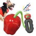 Green and red plastic dog toy with food dropping ball and molar chew design